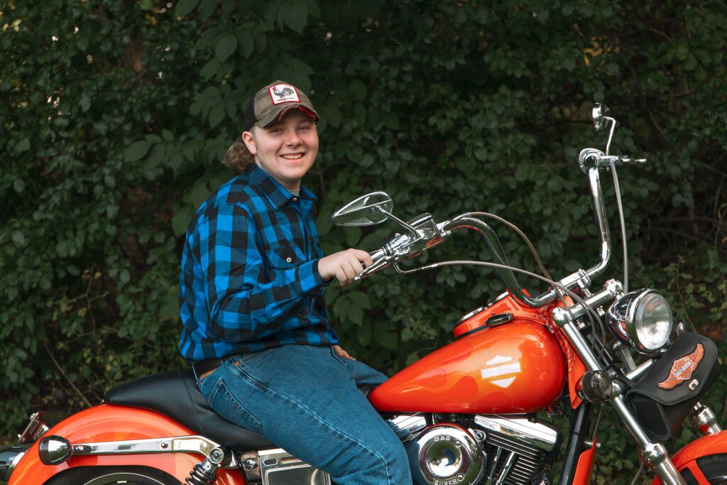 Senior portrait of student on motorcycle in Greater Boston, Massachusetts.