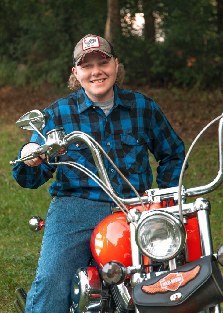 Senior portrait of student on motorcycle in Greater Boston, Massachusetts.