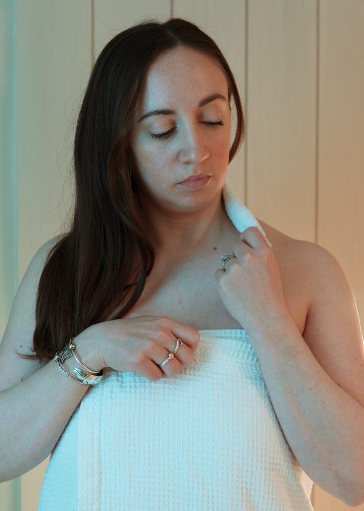 Women in towel for branding photography session in Revival Wellness Studio in Medfield, Massachusetts.
