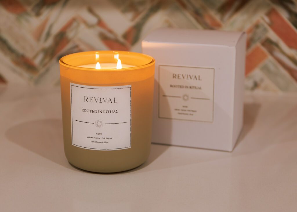A lit Revival candle for branding photography session in Revival Wellness Studio in Medfield, Massachusetts.
