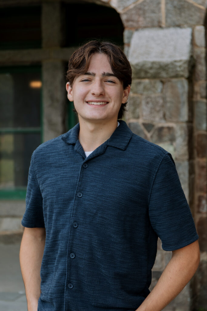 High School Senior Smiling at Camera for Photoshoot.
