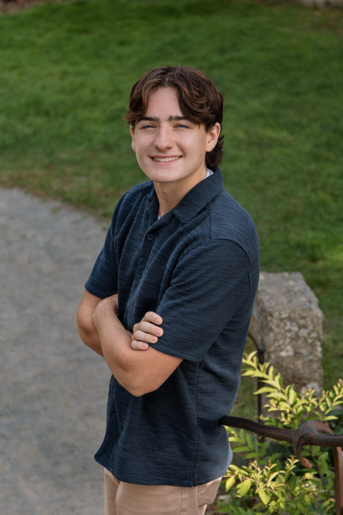Student smiling in senior portrait photography session at Borderland State Park, Easton, Massachusetts.