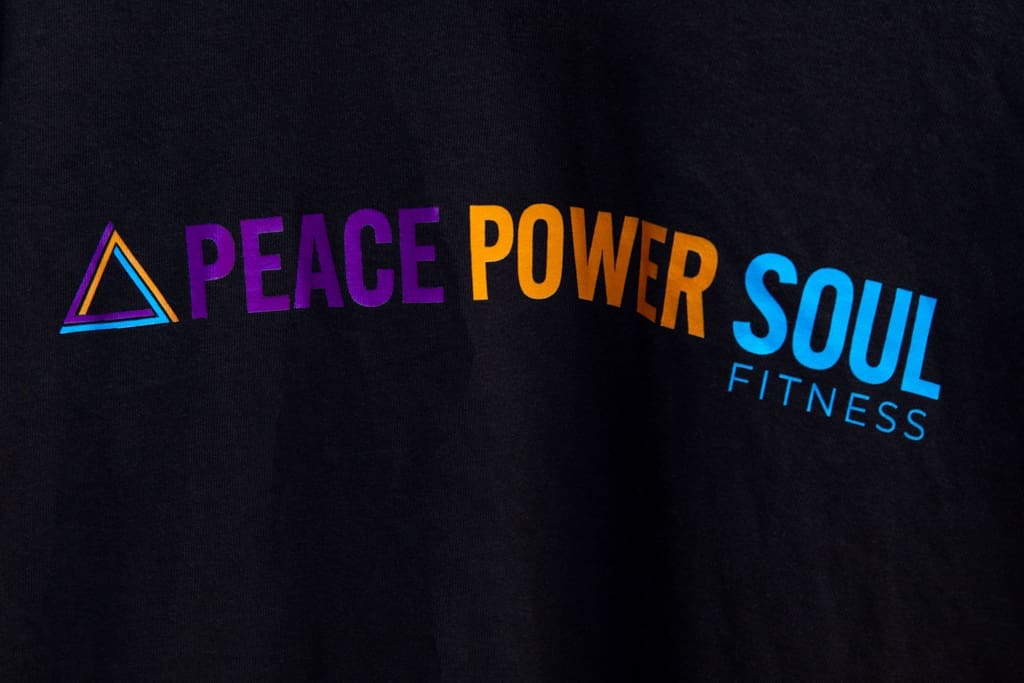 Close up of branded t-shirt for fitness studio fashion-inspired branding photoshoot in Easton, Massachusetts.
