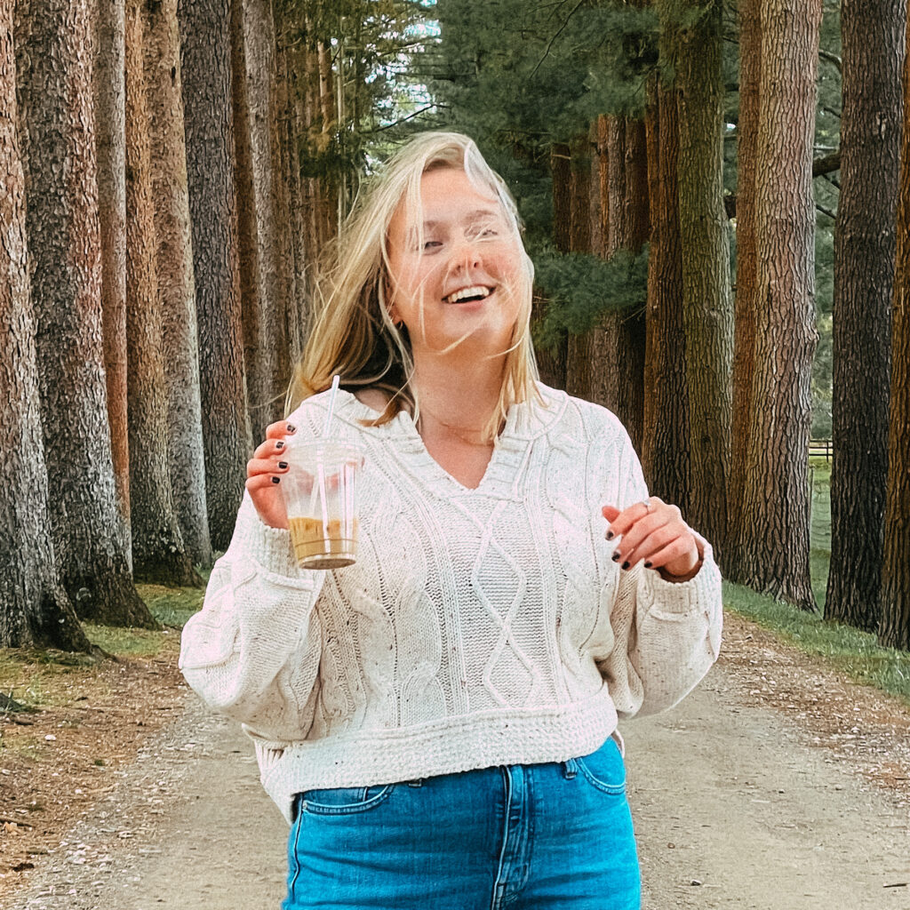 Woman smiling at camera for self portrait photoshoot in Massachusetts with Emma Lula Creative.
