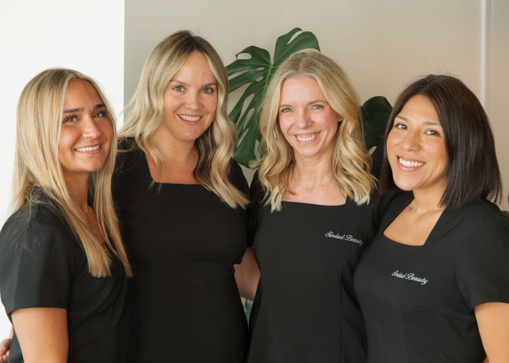 Group photo of all-women team at Sinead Beauty during brand photoshoot with Emma Lula Creative.