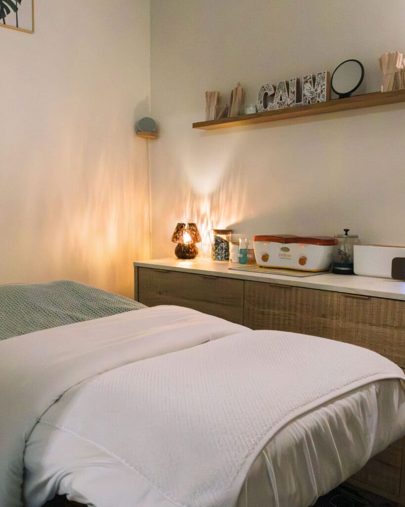 Esthetician treatment room during photoshoot with beauty branding photographer in Massachusetts.
